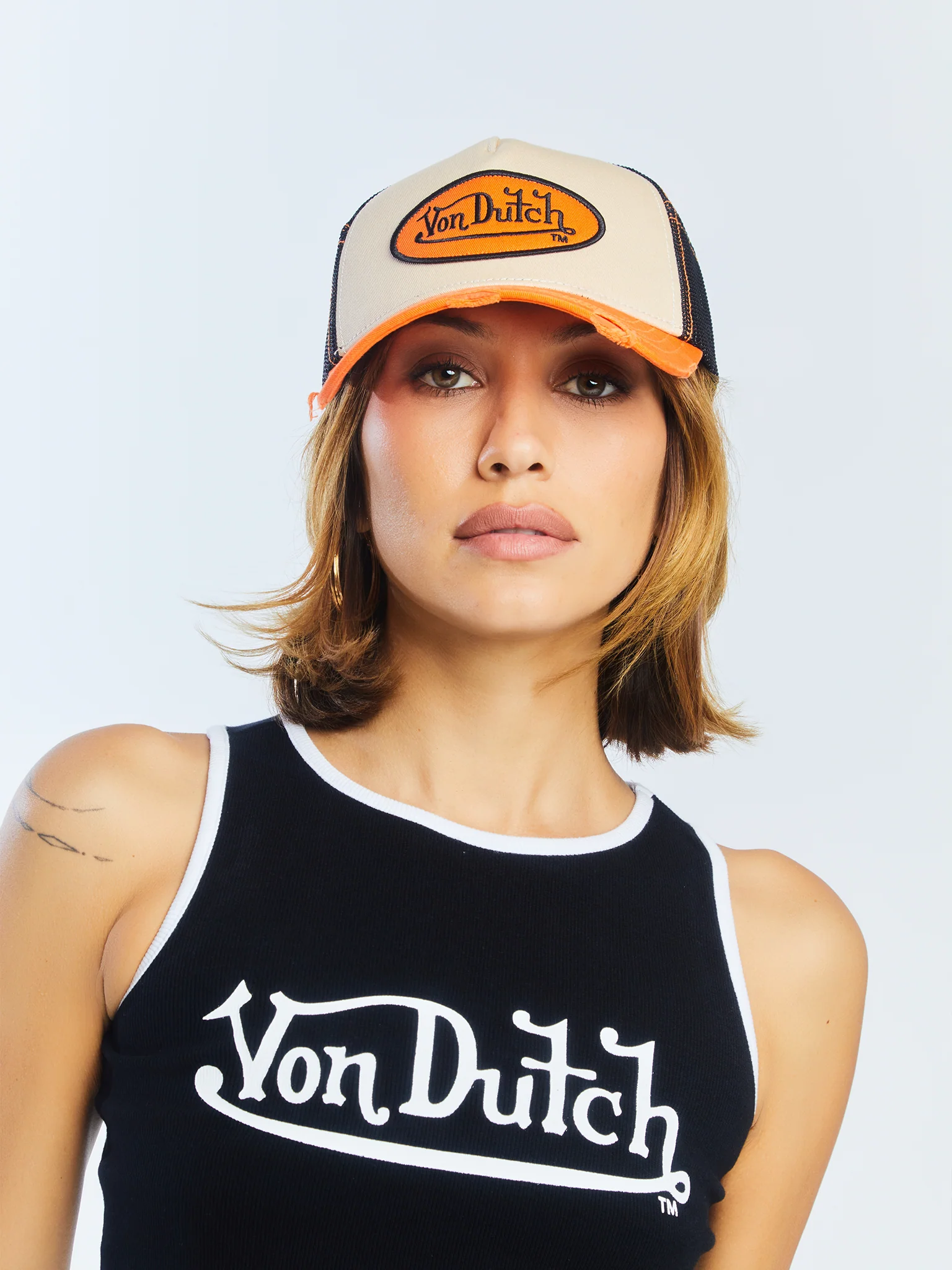 1103-tan-orange-classic-distressed-trucker-hat-6.webp Tan & Orange Classic Distressed Trucker Hat