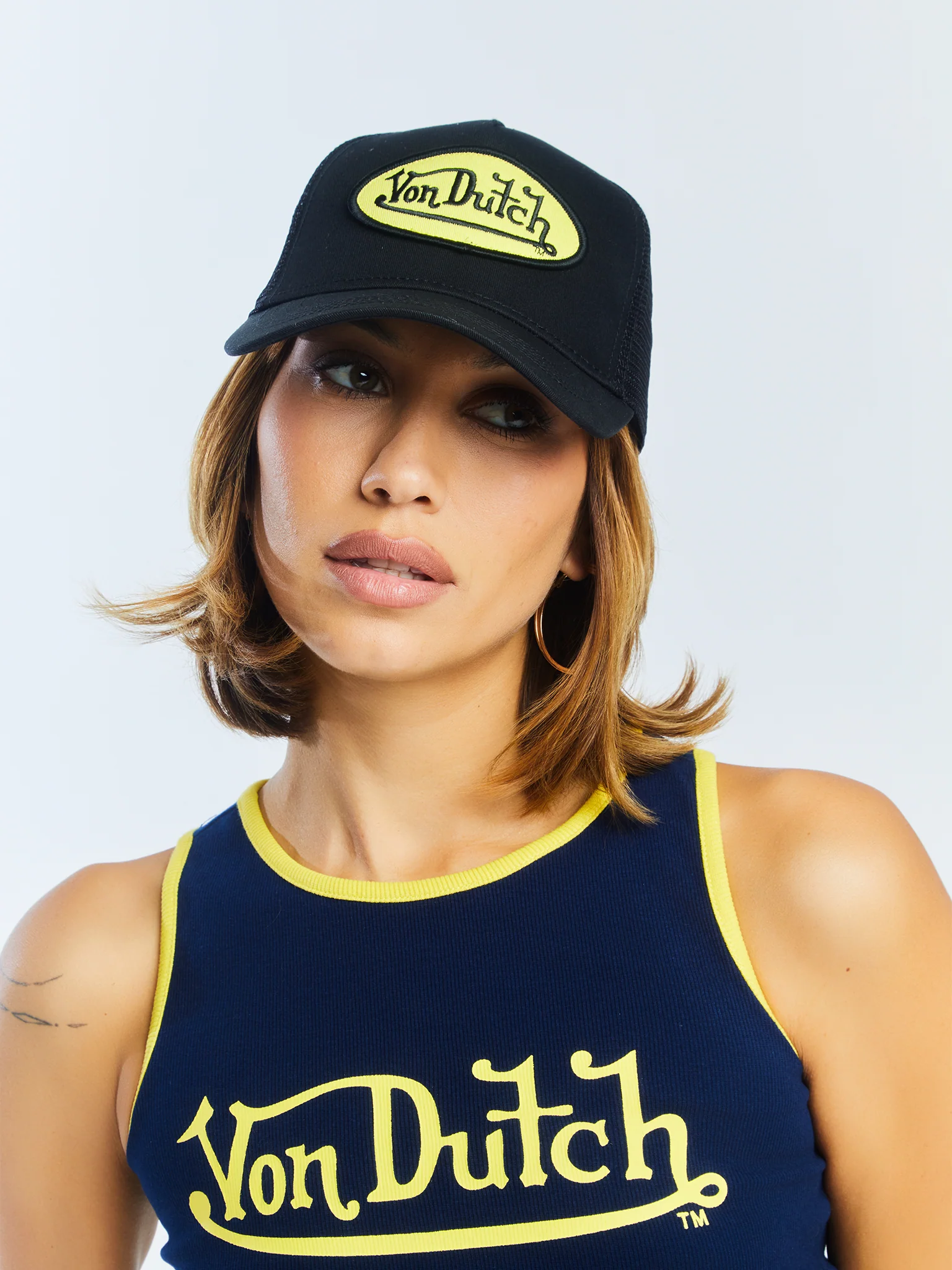 990-black-yellow-trucker-hat-6.webp Black & Yellow Trucker Hat